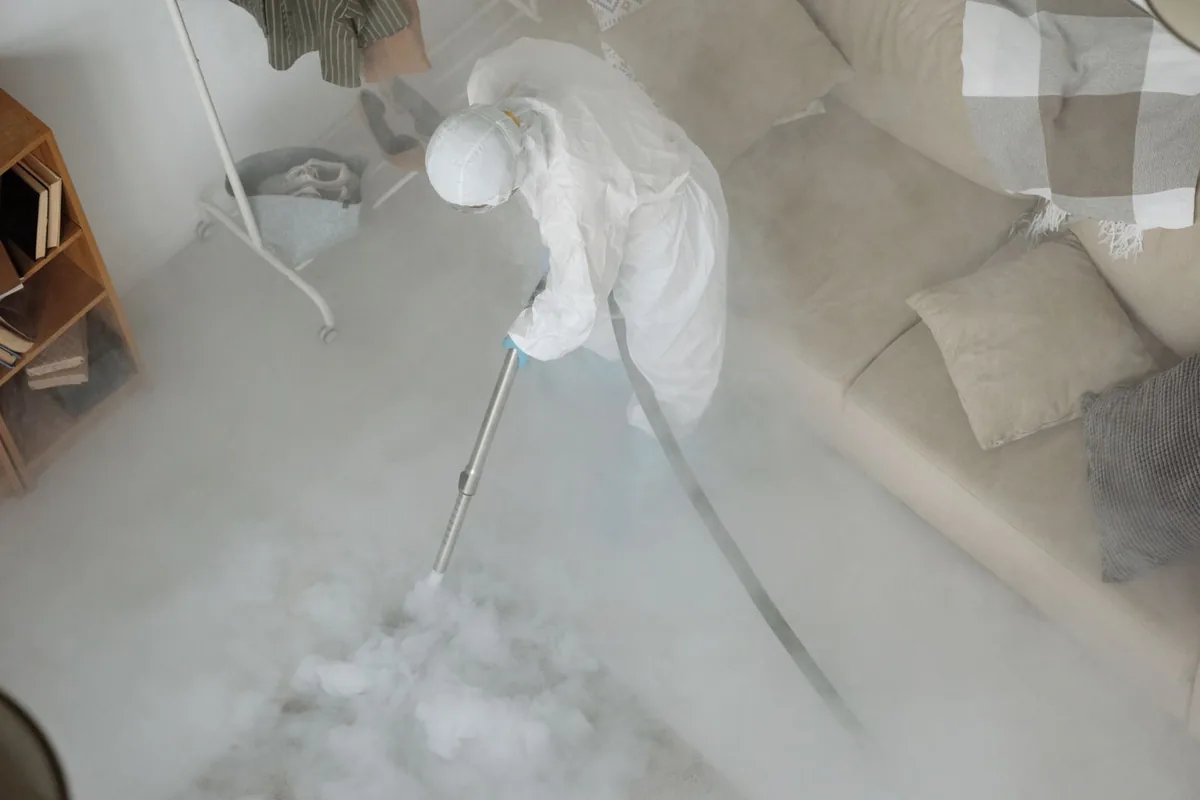 Biohazard cleanup technician in protective equipment, Muscoy, CA